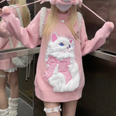 Person wearing a pink outfit with a cat design in a store setting